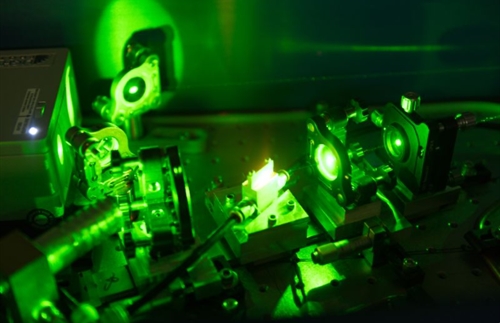 What are the key characteristics of laser gain media?